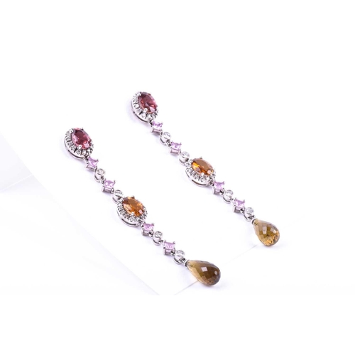 635 - A pair of diamond, sapphire, and tourmaline drop earrings, set with a mixed oval-cut pink tourmaline... 