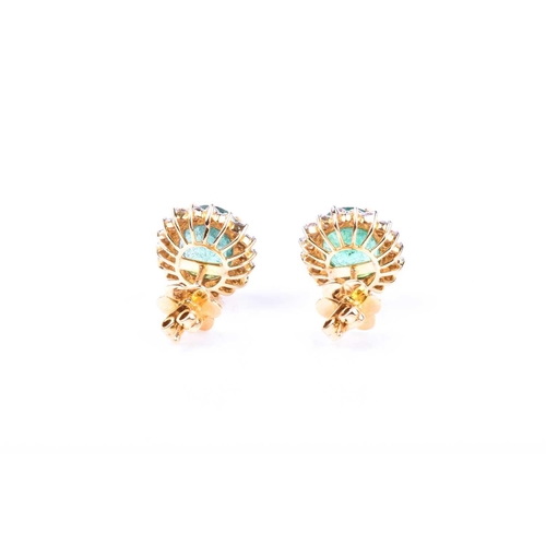 636 - A pair of diamond and emerald cluster earrings, set with mixed oval-cut emeralds of approximately 5.... 