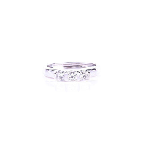 641 - An 18ct white gold and diamond ring, set with three princess-cut diamonds of approximately 0.40 cara... 