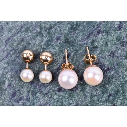 642 - A pair of reversable pearl and gold stud earrings (to wear either way), together with a pair of pear... 