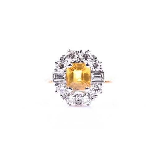 644 - A diamond and yellow sapphire cluster ring, set with a mixed rectangular-cut yellow sapphire of appr... 