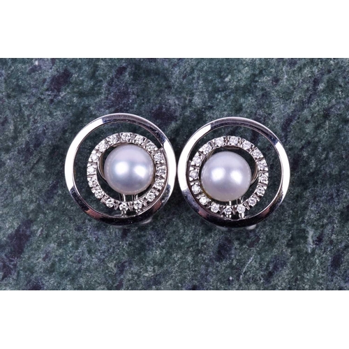 647 - A pair of 14ct white gold, diamond, and pearl earrings of circular form, designed as concentric circ... 