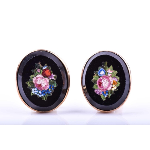 654 - A pair of micro mosaic earrings, of oval design, the black mounts inset with micro mosaic floral des... 