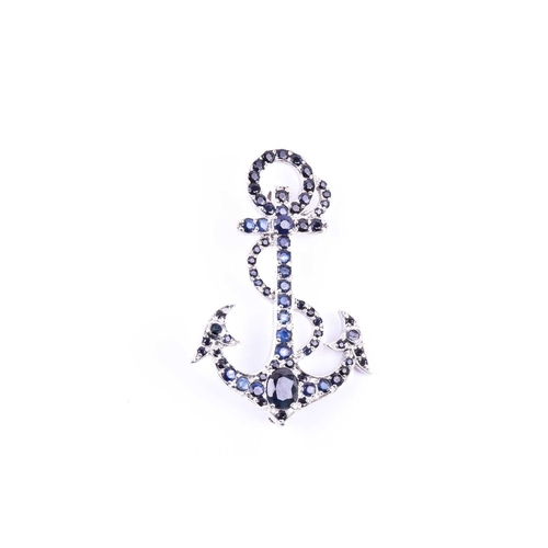 656 - A silver and sapphire anchor brooch, set with mixed round- and oval-cut sapphires, marked 925 to ver... 