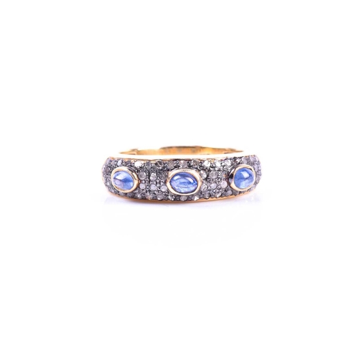 662 - A silver gilt, diamond, and sapphire ring, set with three cabochon sapphires, the mount pave set wit... 