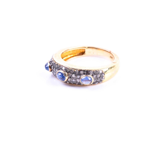 662 - A silver gilt, diamond, and sapphire ring, set with three cabochon sapphires, the mount pave set wit... 