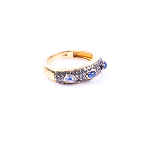 662 - A silver gilt, diamond, and sapphire ring, set with three cabochon sapphires, the mount pave set wit... 