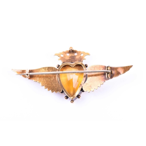 666 - A yellow metal, citrine, and pearl brooch, set with a heart-shaped citrine, surmounted with a crown ... 