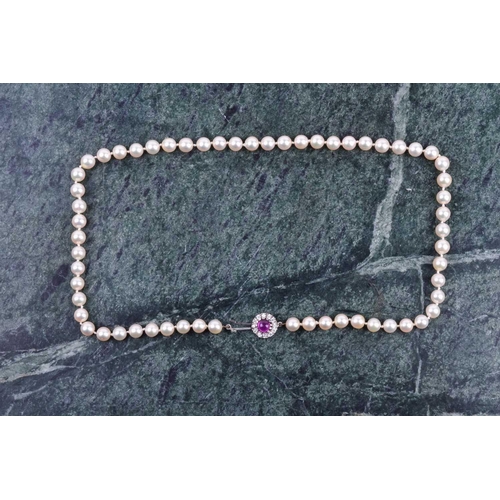 670 - A cultured pearl necklace, individually knotted pearls, approximately 6 mm diameter, fastened with a... 