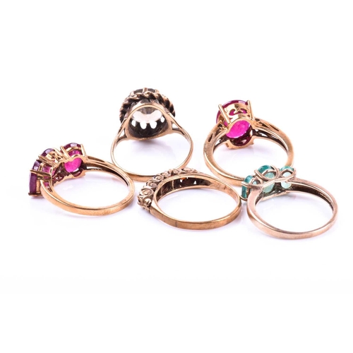 681 - A 9ct yellow gold and emerald ring, together with two 9ct yellow gold and reconstituted ruby rings, ... 