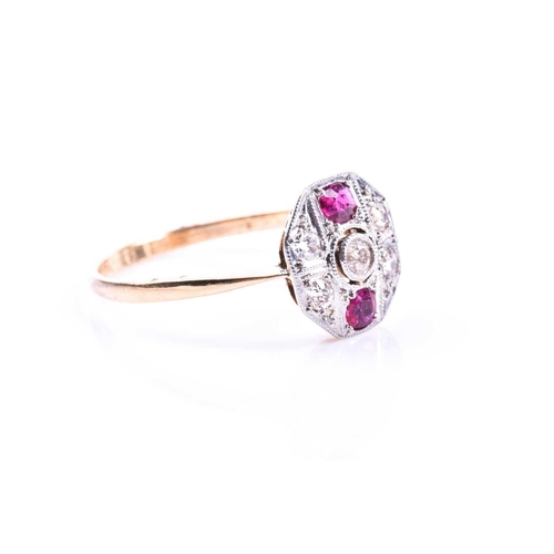 688 - An Art Deco diamond and ruby ring, the octagonal mount set with round-cut diamonds and two round-cut... 