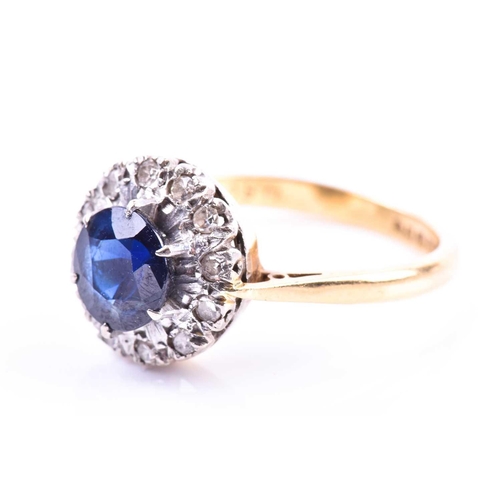 692 - An 18ct yellow gold, diamond, and sapphire cluster ring, set with a round-cut sapphire, surrounded w... 