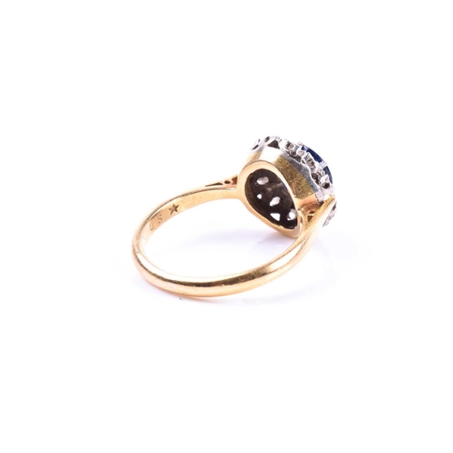 692 - An 18ct yellow gold, diamond, and sapphire cluster ring, set with a round-cut sapphire, surrounded w... 