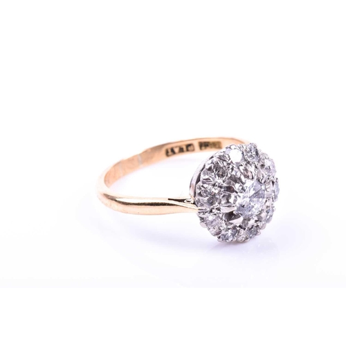 693 - An 18ct yellow gold and diamond cluster ring, centred with a round-cut diamond of approximately 0.33... 