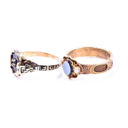 695 - A Victorian yellow gold and enamel mourning ring, inset with a diamond surrounded with black enamel,... 