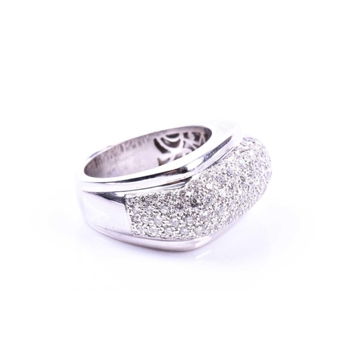 697 - An unusual diamond cocktail ring, pave-set with round brilliant-cut diamonds on an angular mount, in... 