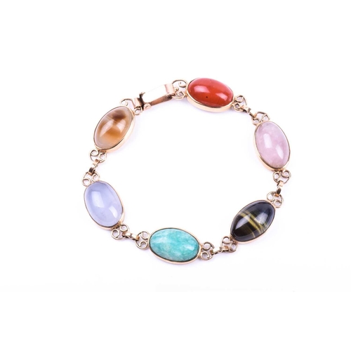 703 - A yellow metal and hardstone bracelet, set with rose quartz, cats eye, and jadeite segments, the cla... 