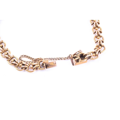 705 - A Continental yellow metal bracelet, with indistinct marks to clasp, with fancy rounded links, 21 cm... 