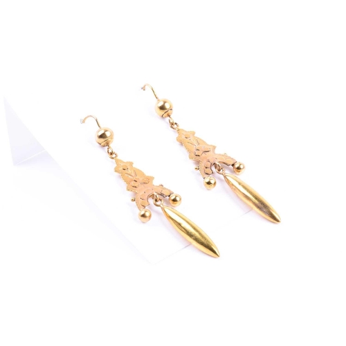 711 - A pair of Victorian yellow gold drop earrings, with elongated drops beneath decorative mounts (test ... 