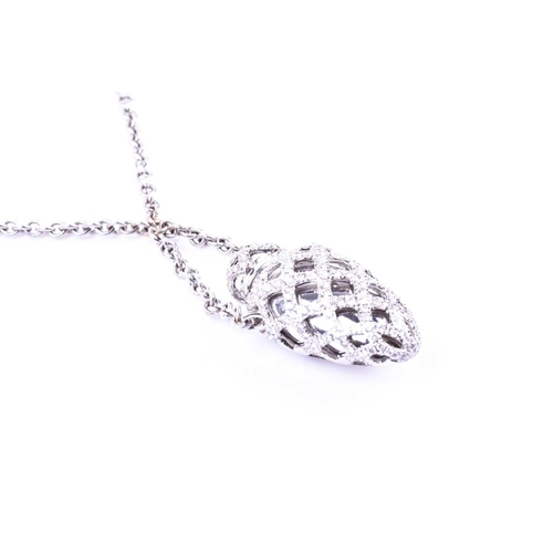 716 - An 18ct white gold and diamond Theo Fennell 'Ampoule' pendant, the bottle pendant with lattice desig... 