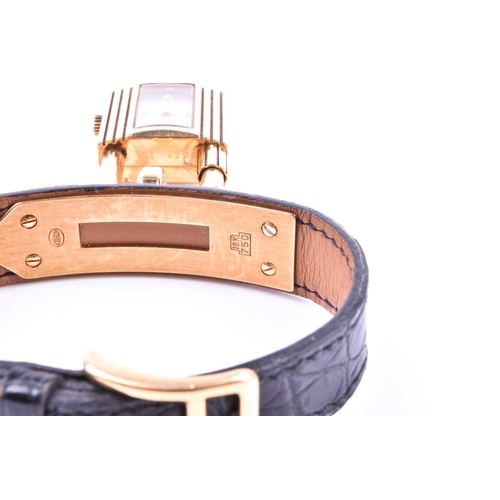 718 - Hermes. A Kelly special anniversary edition 18ct gold padlock watch, the two piece screwed padlock c... 