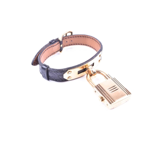 718 - Hermes. A Kelly special anniversary edition 18ct gold padlock watch, the two piece screwed padlock c... 