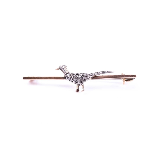 723 - A 9ct yellow gold and diamond pheasant brooch, the body of the pheasant inset with diamond accents, ... 