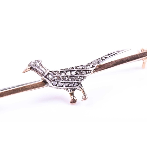 723 - A 9ct yellow gold and diamond pheasant brooch, the body of the pheasant inset with diamond accents, ... 