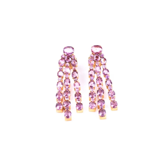 726 - A pair of pink tourmaline drop earrings, each set with mixed round- and oval-cut pink tourmalines, i... 