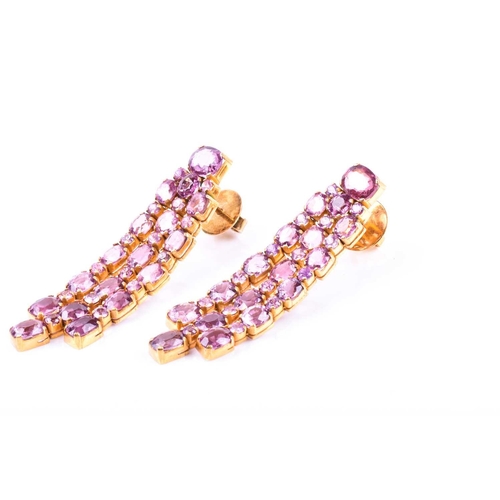 726 - A pair of pink tourmaline drop earrings, each set with mixed round- and oval-cut pink tourmalines, i... 