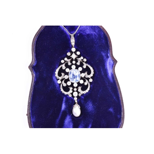 729 - An impressive diamond, sapphire, and pearl pendant, the openwork mount centred with a cushion-cut Ce... 