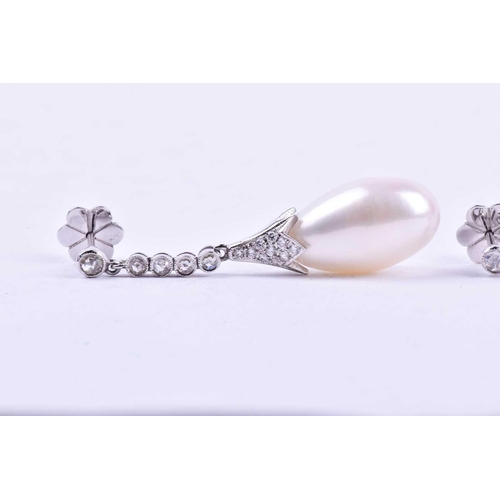 731 - A pair of diamond and pearl drop earrings, each with an elongated cultured pearl, set in a diamond-s... 