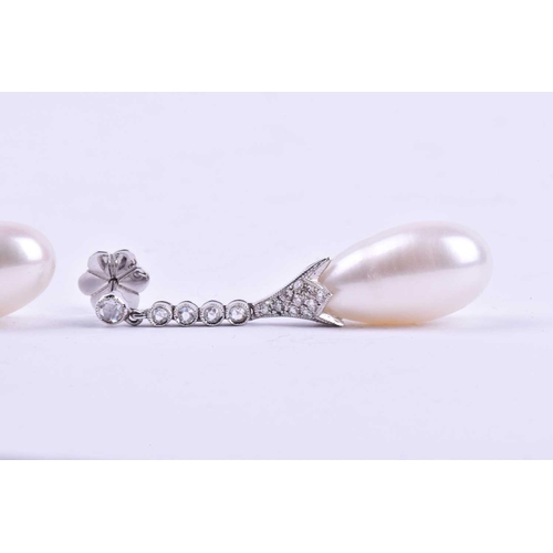 731 - A pair of diamond and pearl drop earrings, each with an elongated cultured pearl, set in a diamond-s... 