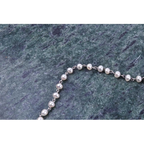 732 - A platinum and pearl necklace, set with small pearls, unmarked (tests as platium), 42 cm long, 7 gra... 