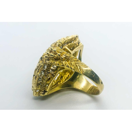 735 - A yellow gold and diamond cocktail ring, the raised navette-shaped mount set with round brilliant-cu... 