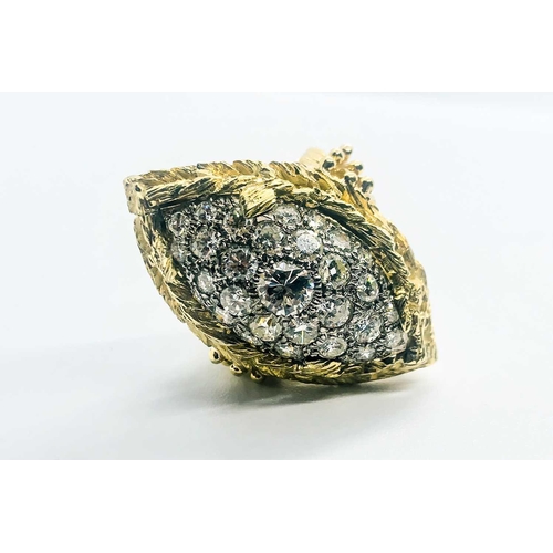 735 - A yellow gold and diamond cocktail ring, the raised navette-shaped mount set with round brilliant-cu... 