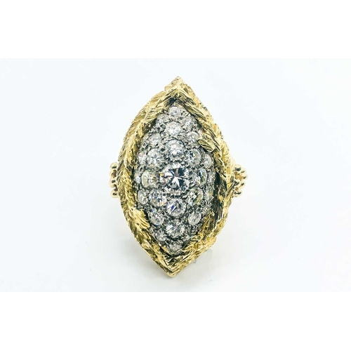 735 - A yellow gold and diamond cocktail ring, the raised navette-shaped mount set with round brilliant-cu... 