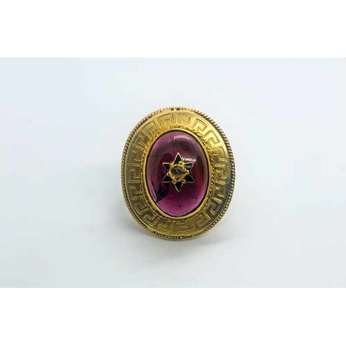 736 - A yellow gold and garnet ring, centred with an oval cabochon garnet, inset with rose-cut diamond and... 