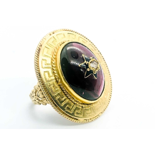 736 - A yellow gold and garnet ring, centred with an oval cabochon garnet, inset with rose-cut diamond and... 