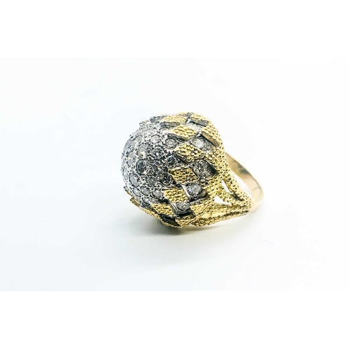 737 - An 18ct yellow gold and diamond bombe ring, by Birks, the rounded bombe mount inset with round brill... 