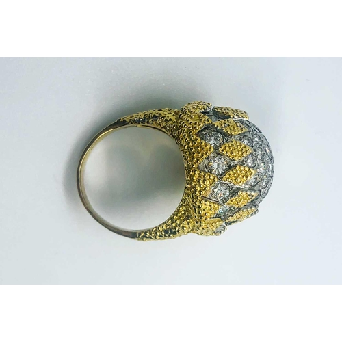 737 - An 18ct yellow gold and diamond bombe ring, by Birks, the rounded bombe mount inset with round brill... 