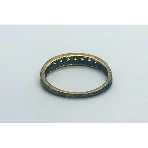 744 - A 9ct yellow gold and diamond ring, set with a row of seven small round-cut diamonds, size N, 1.8 gr... 