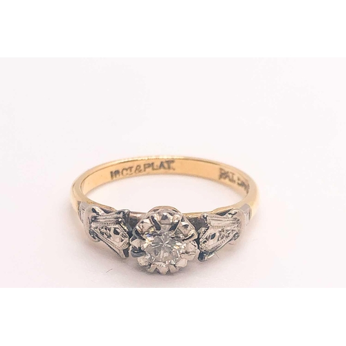 748 - An 18ct yellow gold solitaire ring, with trefoil platinum shoulders, and a collet-set diamond of app... 