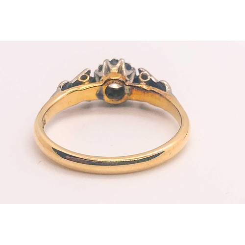 748 - An 18ct yellow gold solitaire ring, with trefoil platinum shoulders, and a collet-set diamond of app... 