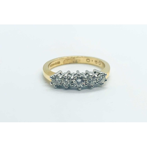 752 - An 18ct yellow gold and diamond ring, set with five diamonds of approximately 0.50 carats combined, ... 