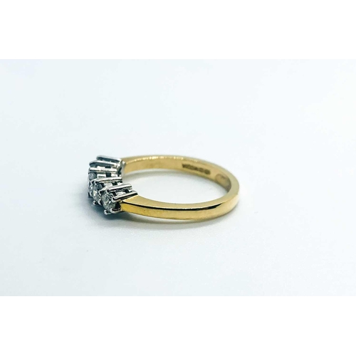 752 - An 18ct yellow gold and diamond ring, set with five diamonds of approximately 0.50 carats combined, ... 