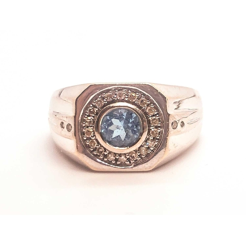 754 - A 9ct white gold, diamond, and topaz gents ring, the squared mount inse with a round-cut topaz, surr... 