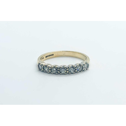 755 - A 9ct yellow gold and diamond half eternity ring, set with seven round-cut diamonds of approximately... 