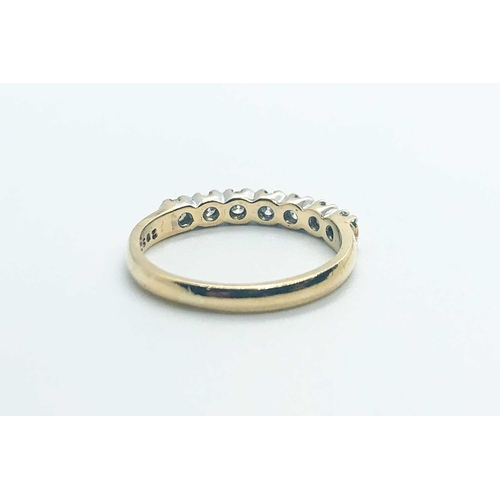 755 - A 9ct yellow gold and diamond half eternity ring, set with seven round-cut diamonds of approximately... 