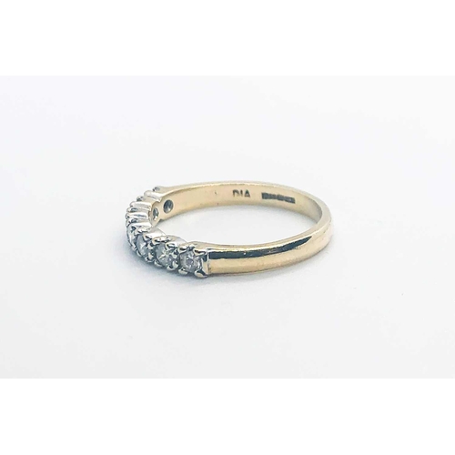 755 - A 9ct yellow gold and diamond half eternity ring, set with seven round-cut diamonds of approximately... 